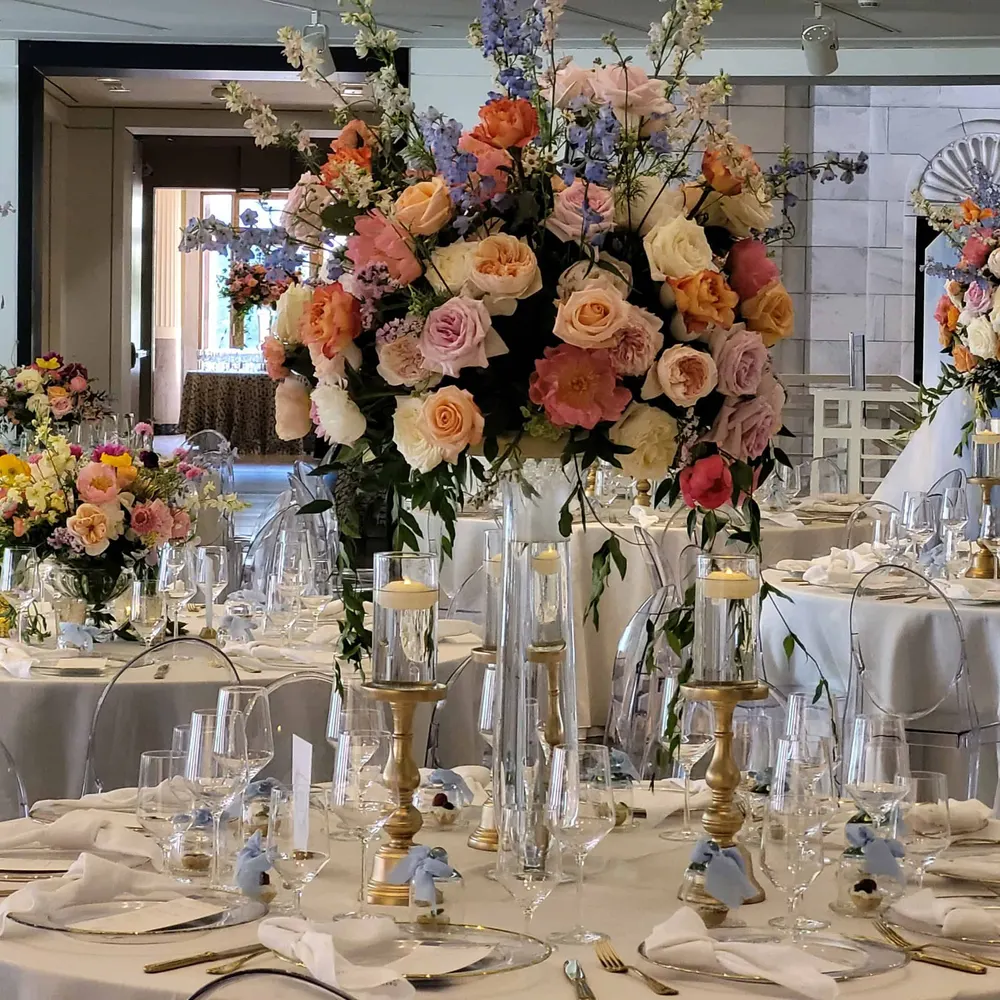 Tall pastel reception centerpiece with candles
