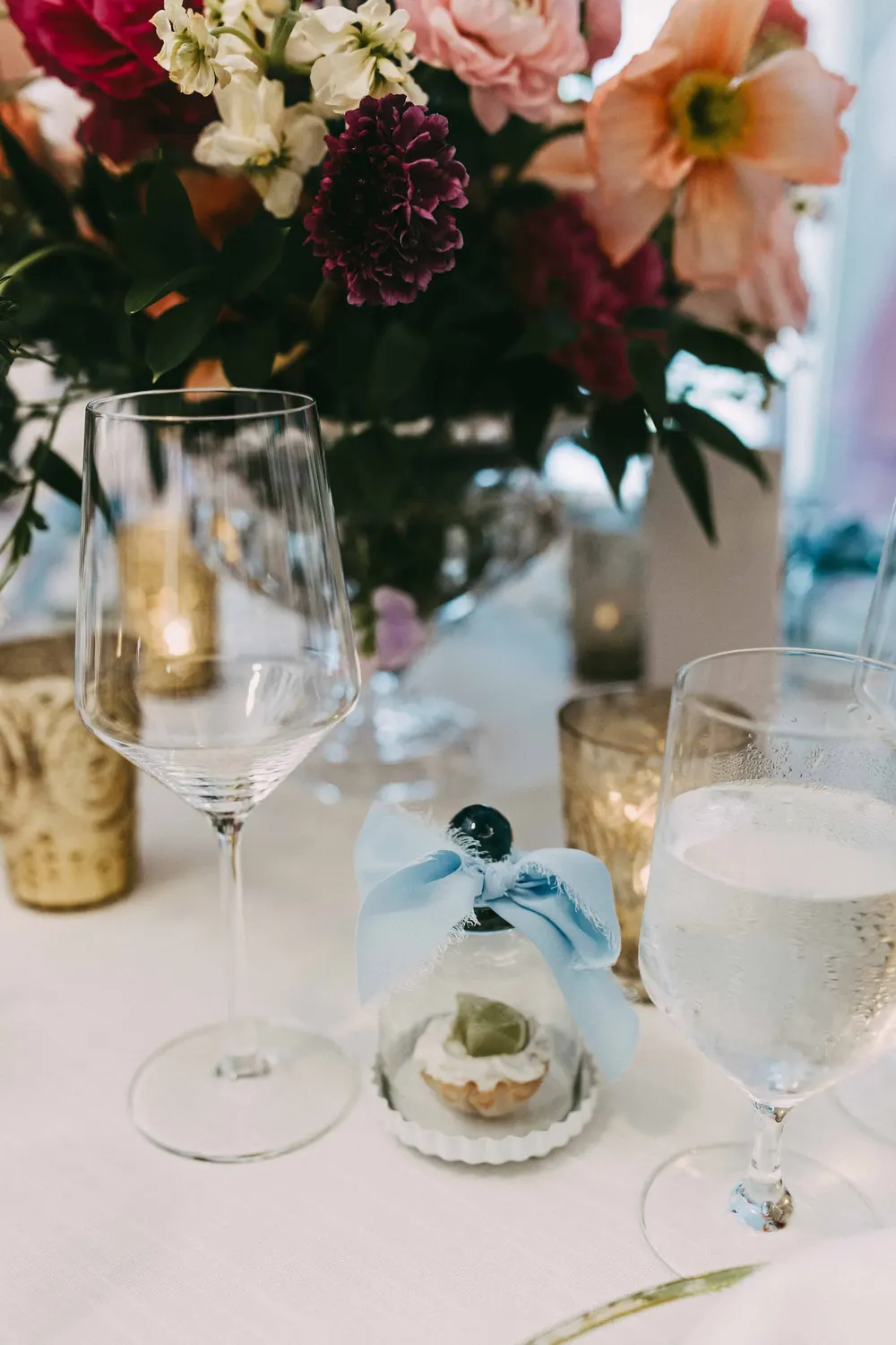 Table setting details with glassware and candles