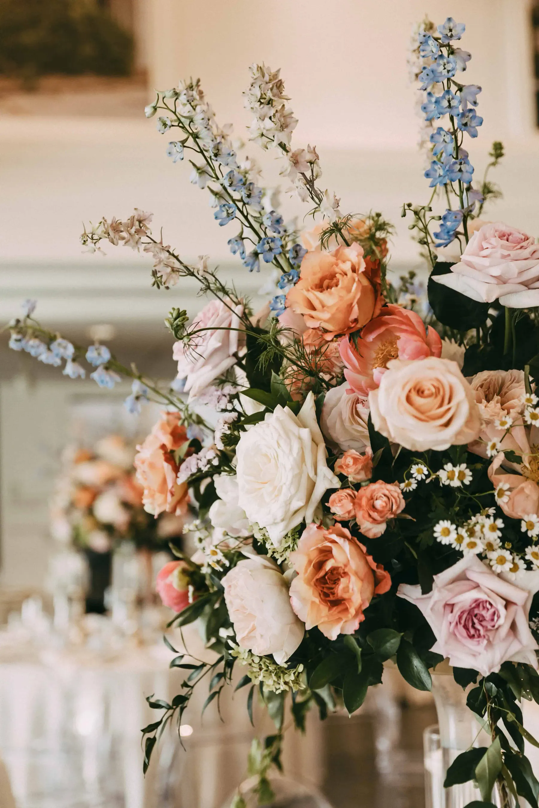 Peach and white garden-style arrangement by Heaslett Design Studio