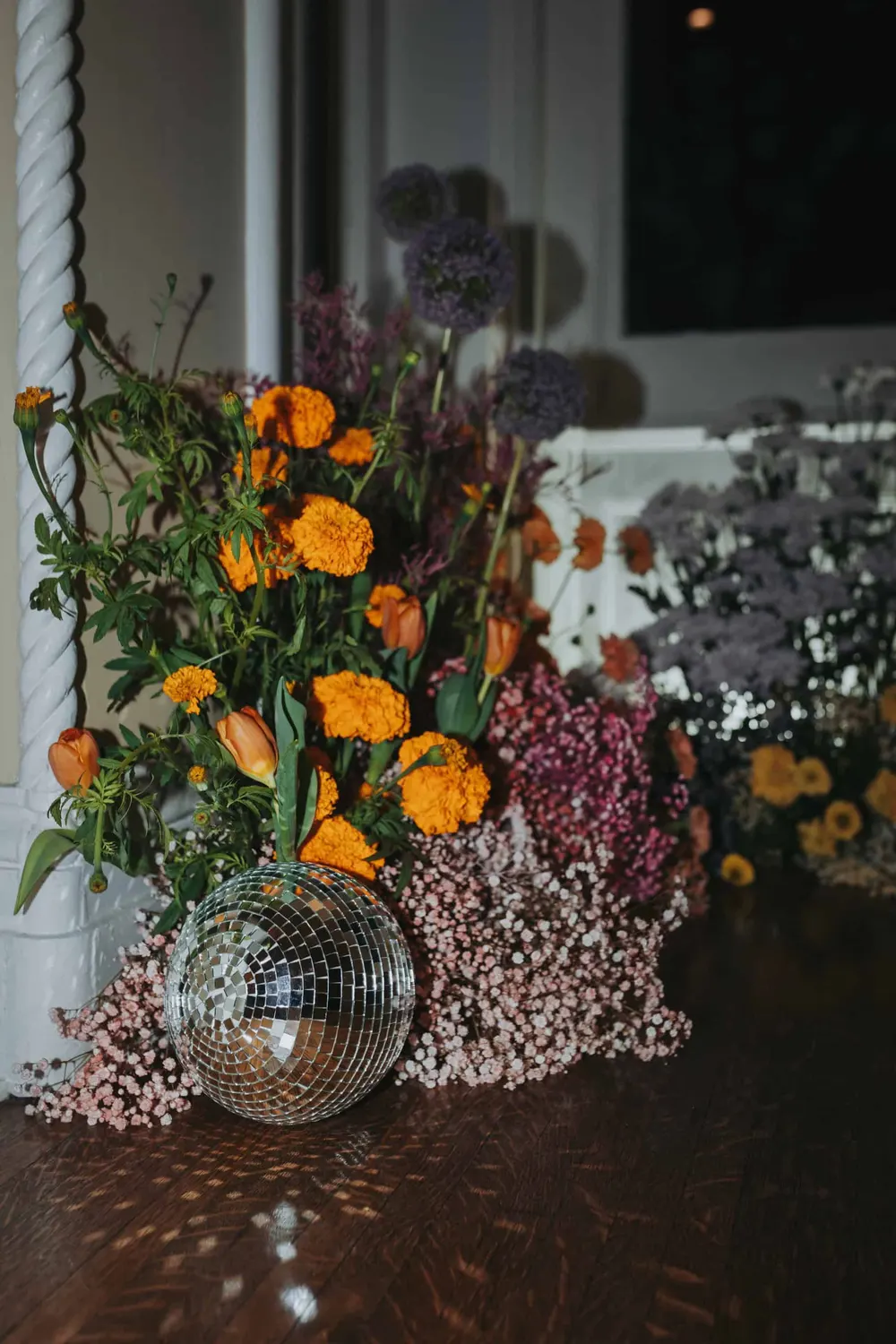 Orange and lilac arrangement with a disco ball at the James Lee House